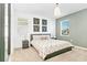 Comfortable bedroom featuring a queen bed, soft neutral colors, and stylish bedside tables at 2618 Calistoga Ave, Kissimmee, FL 34741