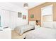 Twin bedroom featuring tan accent wall, and simple decor with two twin beds at 2618 Calistoga Ave, Kissimmee, FL 34741