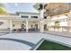 Clubhouse with a covered patio and comfortable seating area overlooking the pool at 2618 Calistoga Ave, Kissimmee, FL 34741