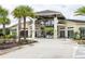 Community entrance with palm trees and modern architecture at 2618 Calistoga Ave, Kissimmee, FL 34741