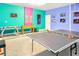 Vibrant game room with ping pong table, foosball table, and playful decor, perfect for entertainment at 2618 Calistoga Ave, Kissimmee, FL 34741