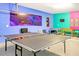 Fun game room featuring ping pong and foosball tables, with colorful walls and playful decorations at 2618 Calistoga Ave, Kissimmee, FL 34741