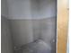 A small bathroom with gray walls and plumbing is ready to be finished at 2963 Embark Trail, St Cloud, FL 34771