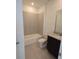 Standard bathroom with a shower-tub combo and granite countertop at 2963 Embark Trail, St Cloud, FL 34771