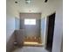 Unfinished bathroom featuring natural light from a window and plumbing prepped for fixtures at 2963 Embark Trail, St Cloud, FL 34771