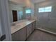 Bathroom features dual sinks, tile flooring, and a glass enclosed shower at 2963 Embark Trail, St Cloud, FL 34771