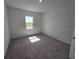 Simple bedroom with carpet flooring and a bright single window at 2963 Embark Trail, St Cloud, FL 34771