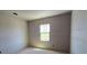 Unfinished bedroom with blank canvas, prepped for customization with natural light from a window at 2963 Embark Trail, St Cloud, FL 34771