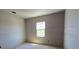Unfinished bedroom with blank canvas, prepped for customization with natural light from a window at 2963 Embark Trail, St Cloud, FL 34771