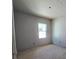 Bedroom with drywall and a window, ready for finishes at 2963 Embark Trail, St Cloud, FL 34771