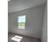 Clean and cozy bedroom with carpet flooring and a single window at 2963 Embark Trail, St Cloud, FL 34771