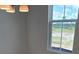 Bright dining area featuring a modern light fixture and a view of the outside at 2963 Embark Trail, St Cloud, FL 34771
