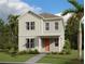 Inviting two-story home with a welcoming front porch and beautiful landscaping at 2963 Embark Trail, St Cloud, FL 34771