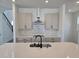 Modern kitchen featuring an island with a sink, stainless steel appliances, and stylish cabinets at 2963 Embark Trail, St Cloud, FL 34771