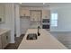 Spacious kitchen featuring an island, stainless steel appliances, and stylish cabinets at 2963 Embark Trail, St Cloud, FL 34771