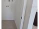 A compact laundry room area with tile flooring and white walls, ready for appliances at 2963 Embark Trail, St Cloud, FL 34771