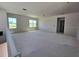 Unfinished living room with blank canvas, prepped for customization with natural light from large windows at 2963 Embark Trail, St Cloud, FL 34771