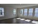 Spacious living room featuring hardwood floors and multiple windows at 2963 Embark Trail, St Cloud, FL 34771