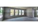 Spacious unfinished living room with large windows allowing natural light at 2963 Embark Trail, St Cloud, FL 34771