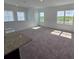 Sun-filled upstairs living space with wall-to-wall carpet and lots of light at 2963 Embark Trail, St Cloud, FL 34771