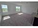 Bright and airy living room with large windows and plush carpeting at 2963 Embark Trail, St Cloud, FL 34771