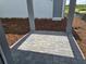 Paver patio featuring gray columns and decorative mulch at 2963 Embark Trail, St Cloud, FL 34771