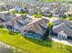 Aerial view shows a backyard pool and screened lanai offering a private outdoor retreat at 3041 Cardillino Way, Kissimmee, FL 34741