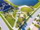 Aerial view of a community park with walking paths, playground, benches, and landscaped areas near the water at 3041 Cardillino Way, Kissimmee, FL 34741