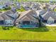 Aerial view highlights a home with a screened-in pool and an expansive backyard at 3041 Cardillino Way, Kissimmee, FL 34741
