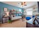 Fun bedroom with bunk beds, blue walls, and colorful decor, perfect for and sleepovers at 3041 Cardillino Way, Kissimmee, FL 34741