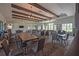 Spacious community room with tables, chairs, and large windows providing natural light at 3041 Cardillino Way, Kissimmee, FL 34741
