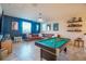 Spacious game room featuring a pool table and comfortable seating for entertainment and relaxation at 3041 Cardillino Way, Kissimmee, FL 34741