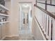 Inviting hallway with tile floors and staircase leading to the second floor, creating a welcoming entrance at 3041 Cardillino Way, Kissimmee, FL 34741