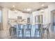 Stylish kitchen with a spacious island, stainless steel appliances, and ample storage in white cabinetry at 3041 Cardillino Way, Kissimmee, FL 34741