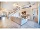 Spacious living room with high ceilings, staircase, tile floors, modern decor, and view to the entry at 3041 Cardillino Way, Kissimmee, FL 34741