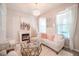 Bright living room with a cozy fireplace, plush sofa, and stylish decor creating a relaxing ambiance at 3041 Cardillino Way, Kissimmee, FL 34741