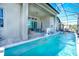 Relax in the pool with a lake view, complemented by outdoor seating and a fun basketball hoop at 3041 Cardillino Way, Kissimmee, FL 34741