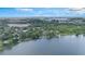 Scenic aerial view of the neighborhood near a tranquil lake and lush green surroundings at 30746 Fairview Ave, Tavares, FL 32778