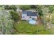 Aerial view of the home with large backyard featuring a wooden patio and above ground pool at 30746 Fairview Ave, Tavares, FL 32778