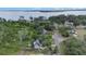 Beautiful aerial shot of the home nestled among trees, near a lake, highlighting its desirable location at 30746 Fairview Ave, Tavares, FL 32778