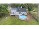 Inviting backyard with a wooden deck and above-ground pool, perfect for outdoor enjoyment at 30746 Fairview Ave, Tavares, FL 32778