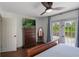 Bedroom featuring a bed and large glass doors to an outdoor deck at 30746 Fairview Ave, Tavares, FL 32778