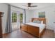 Bedroom featuring a bed and large glass doors to an outdoor deck at 30746 Fairview Ave, Tavares, FL 32778