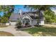 Charming single-Gathering home with a well-manicured lawn, beautiful landscaping, and a two-car attached garage at 30746 Fairview Ave, Tavares, FL 32778
