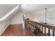 Bright and spacious loft area features wood floors and access to a bedroom at 30746 Fairview Ave, Tavares, FL 32778