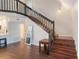 View of the staircase with dark wood railing and wood steps at 30746 Fairview Ave, Tavares, FL 32778
