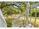View of a lush backyard from a wooden staircase, offering a glimpse of serene outdoor space at 3137 East St, Oviedo, FL 32765