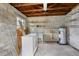 An unfinished basement area featuring exposed ceiling beams and concrete block walls at 3137 East St, Oviedo, FL 32765