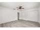 Bedroom featuring wood-look floors and double closets for ample storage at 3137 East St, Oviedo, FL 32765