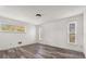Bright bedroom with laminate flooring, base trim and natural light at 3137 East St, Oviedo, FL 32765